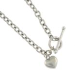 A 9ct gold curb-link necklace, with T-bar clasp and heart-shape charm.Hallmarks for Sheffield.