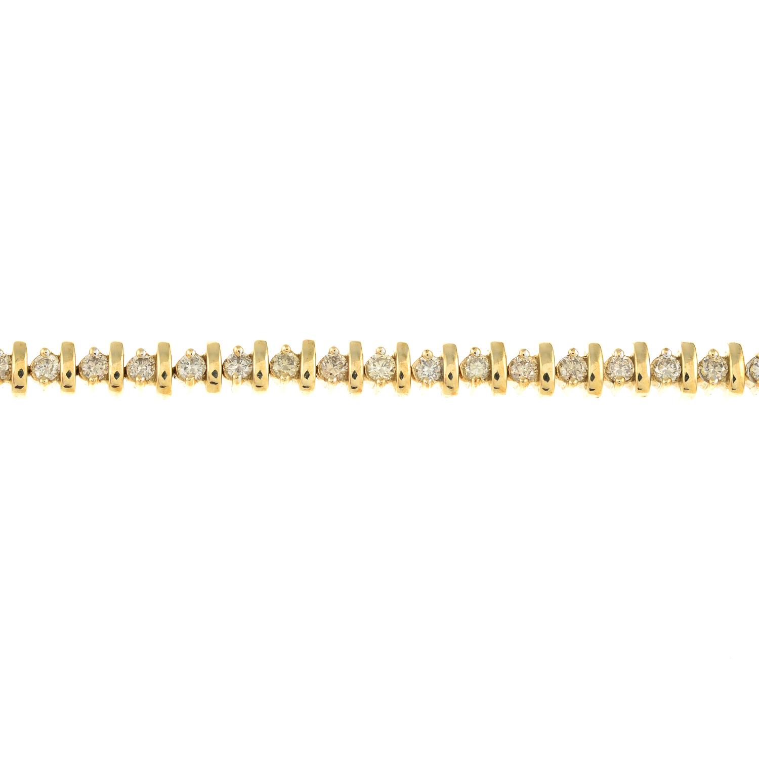 A 9ct gold brilliant-cut diamond line bracelet.Total diamond weight 2cts,