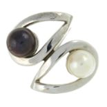 A cultured pearl crossover ring.Stamped 14K.