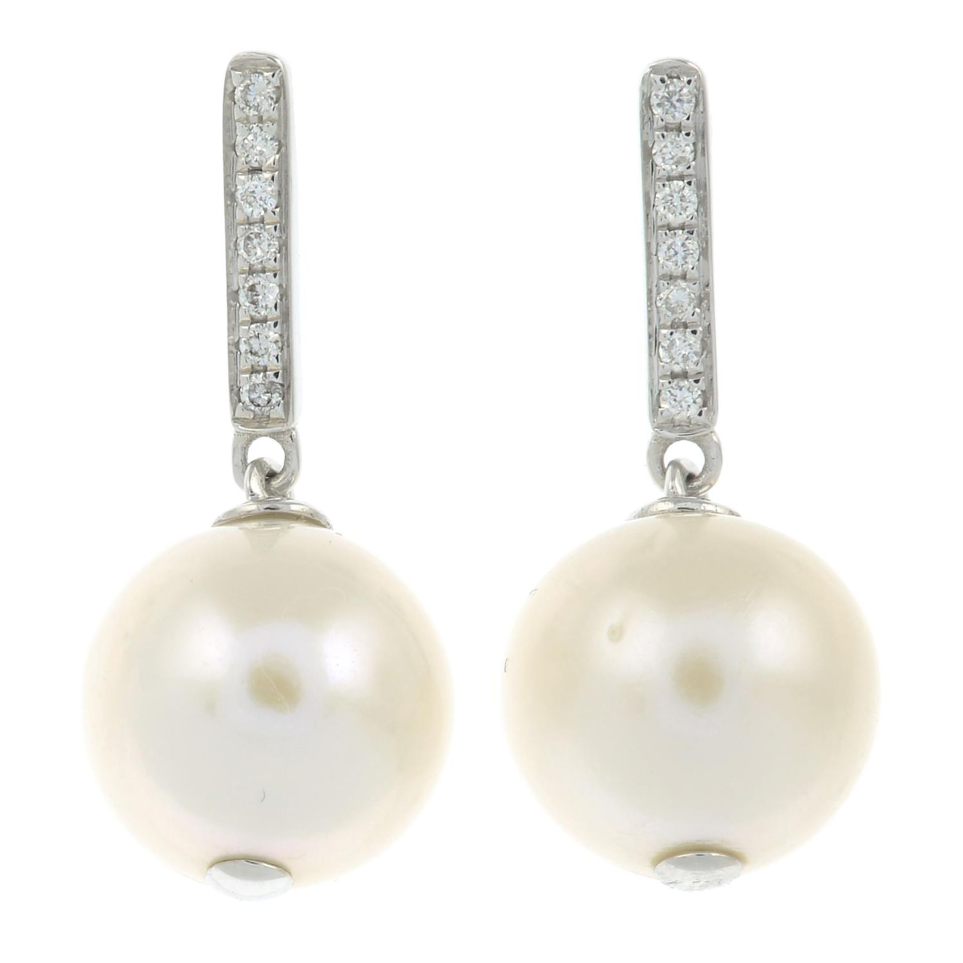 A pair of cultured pearl and diamond drop earrings.Cultured pearls measuring 9.8 and 9.7mms.