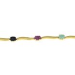 A ruby, sapphire and emerald bracelet.Stamped 750.Length 18cms.