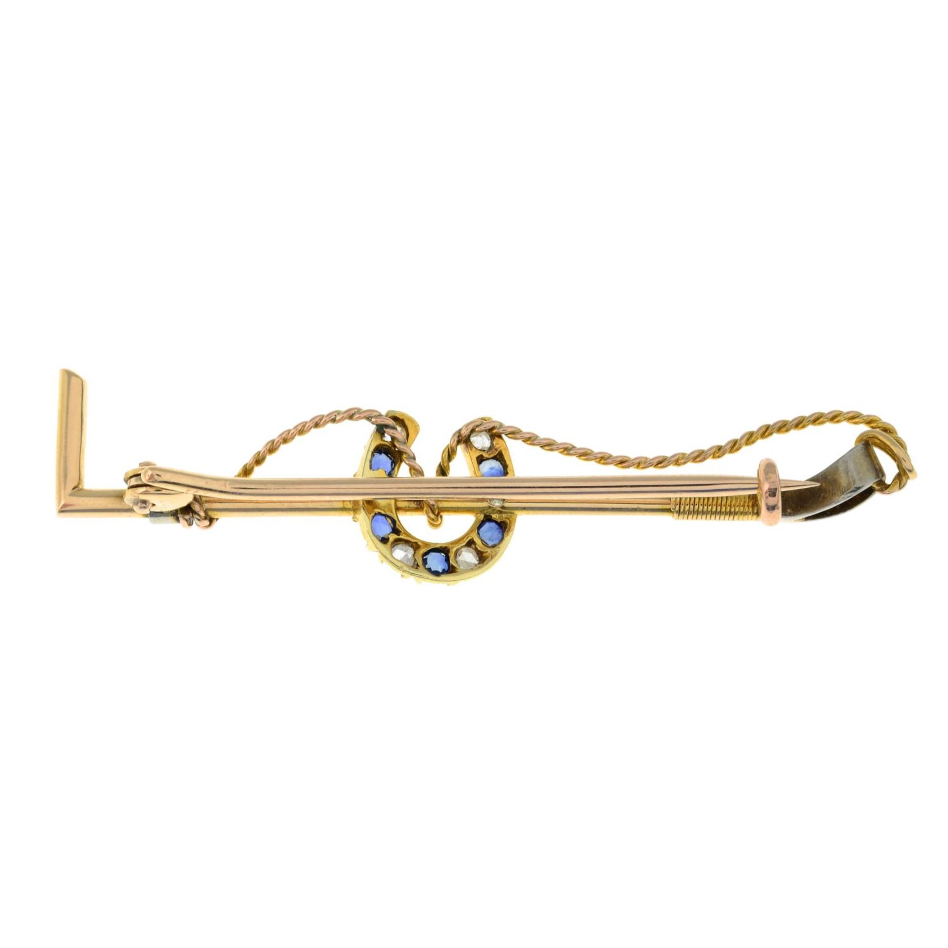 An early 20th century gold sapphire and rose-cut diamond horseshoe and riding crop brooch.Length - Image 2 of 2