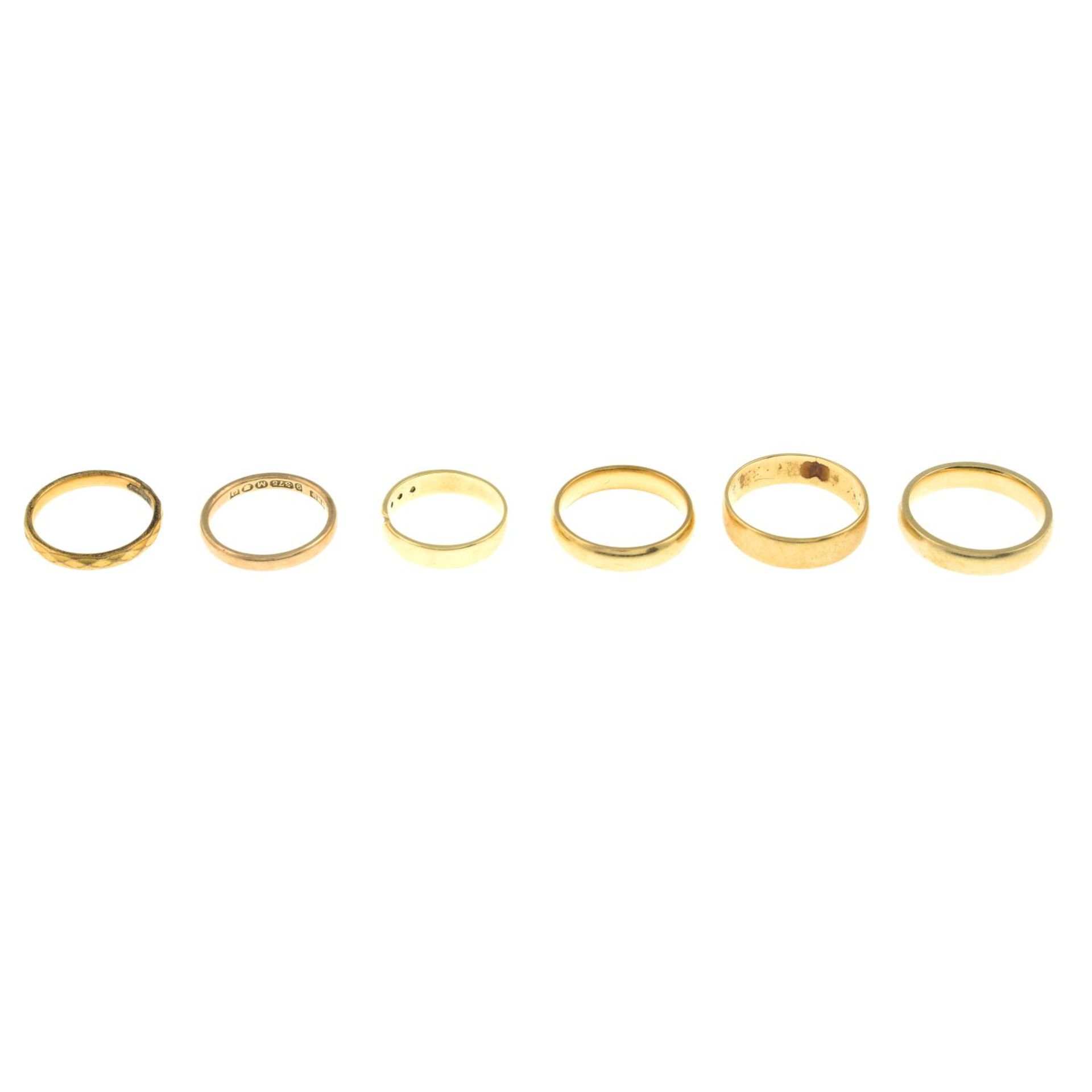 Four 9ct gold band rings, hallmarks for 9ct gold, ring sizes K to P, 12.4gms.