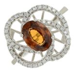 A zircon and diamond ring.Total diamond weight 0.39ct, stamped to band.