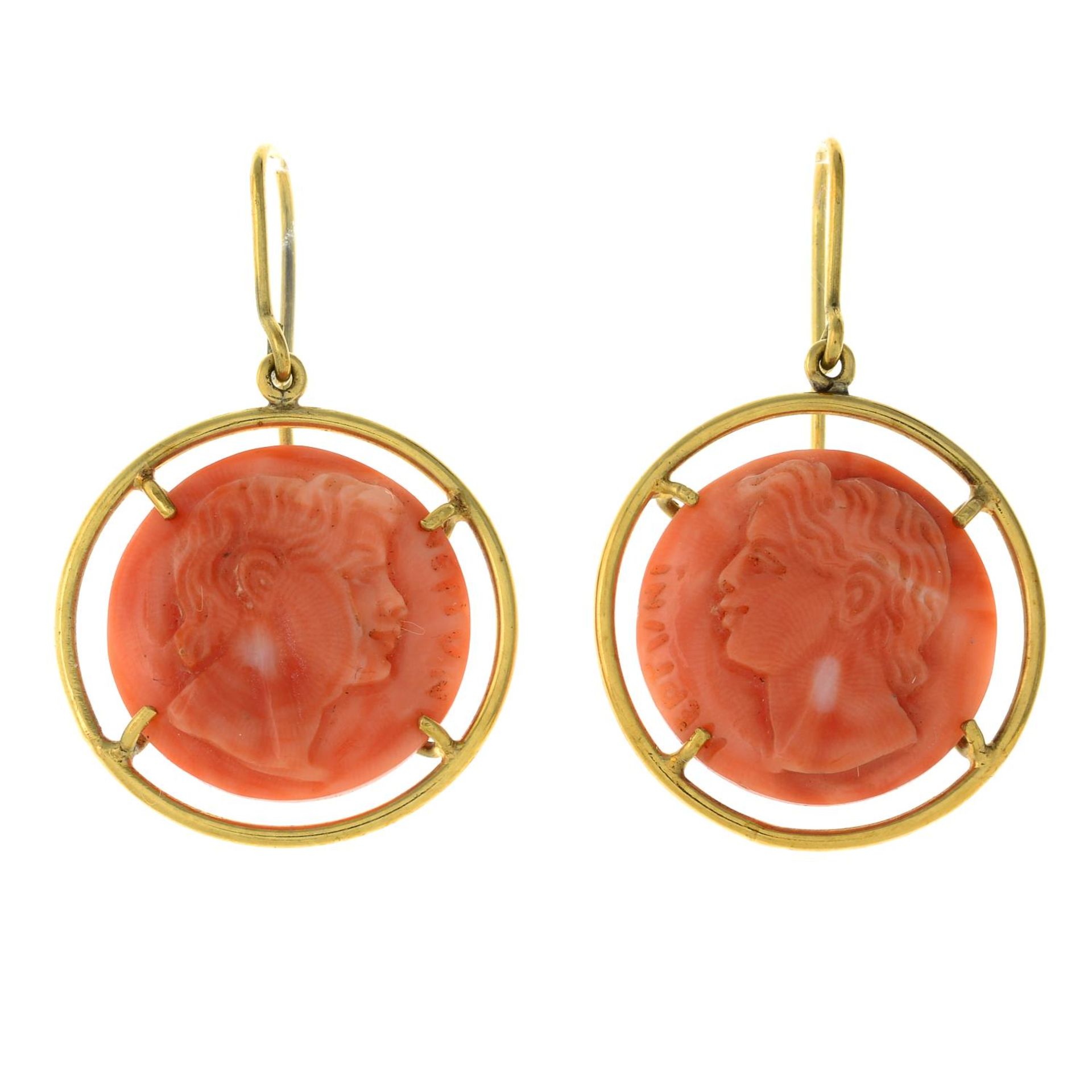 A pair of coral cameo earrings.Length 3.8cms.