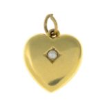 An early 20th century split pearl heart pendant.Stamped 15.