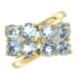 A 9ct gold aquamarine and diamond dress ring.Estimated total diamond weight 0.10ct.