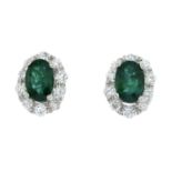 A pair of emerald and brilliant-cut diamond earrings.Total emerald weight 1.02cts.Total diamond