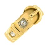 An 18ct gold old-cut diamond buckle ring.Estimated total diamond weight 0.25ct,