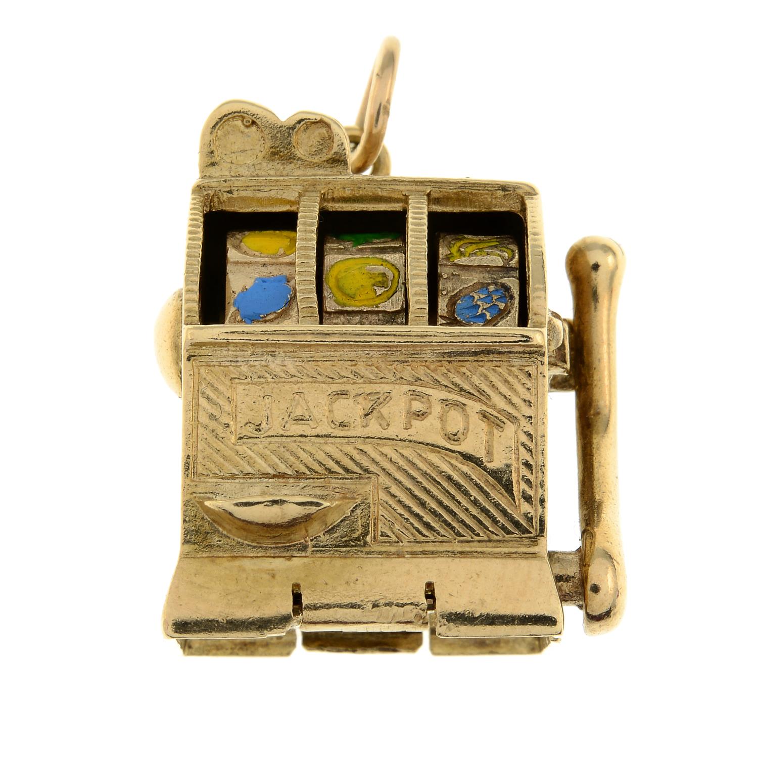 A 9ct gold and enamel bandit machine pendant.Hallmarks for 9ct gold.