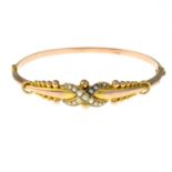 An early 20th century 9ct gold split pearl hinged bangle.Hallmarks for Chester,