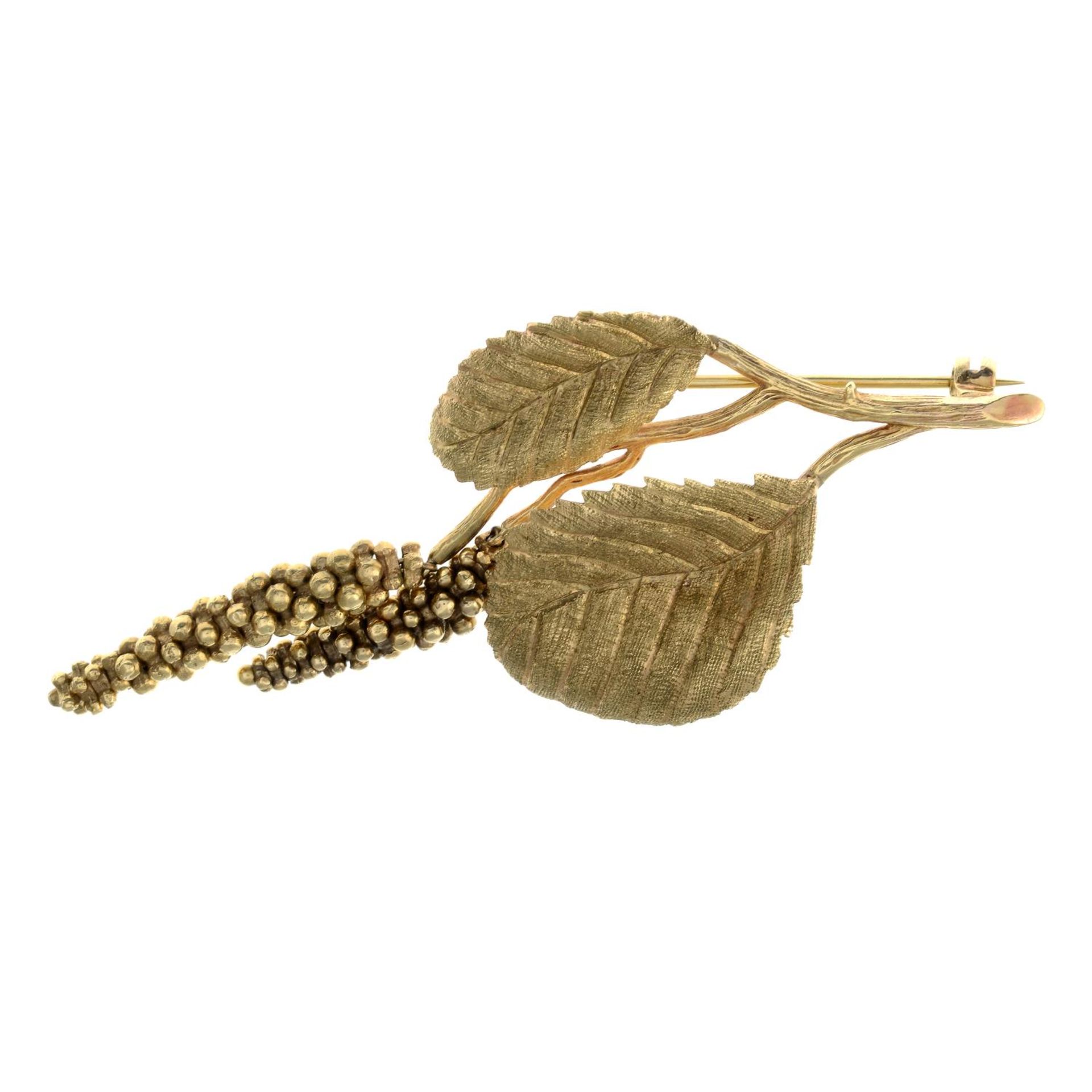A 9ct gold brooch, designed to depict textured leaves and catkins.Hallmarks for 9ct gold.