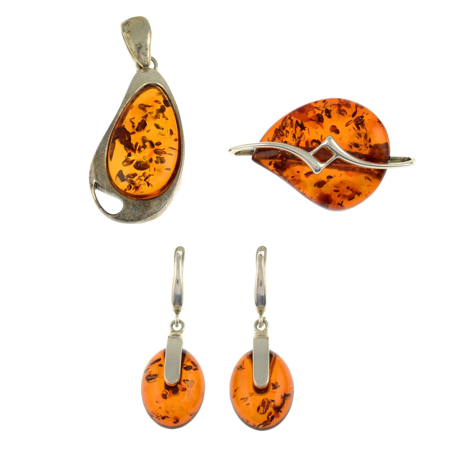 A selection of amber jewellery and a pair of tigers eye cufflinks.Many with marks to indicate