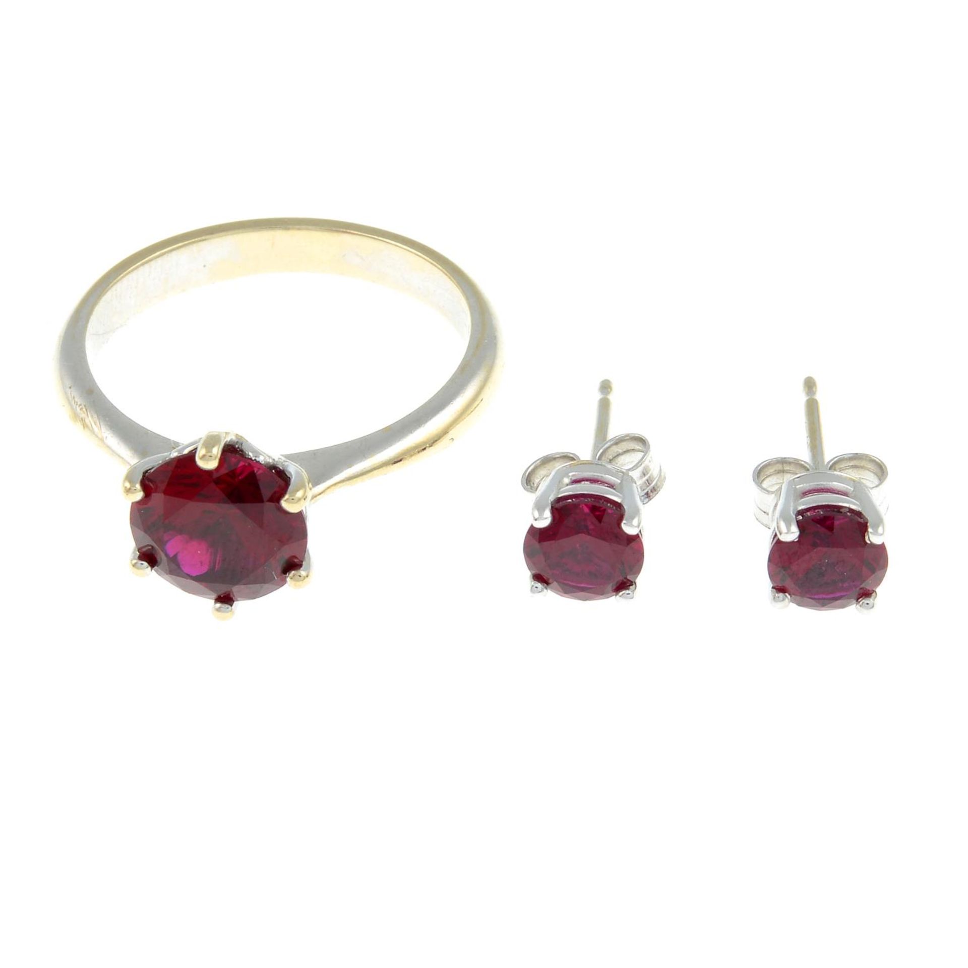 A red paste single-stone rings and a pair of red paste single-stone earrings.A red paste