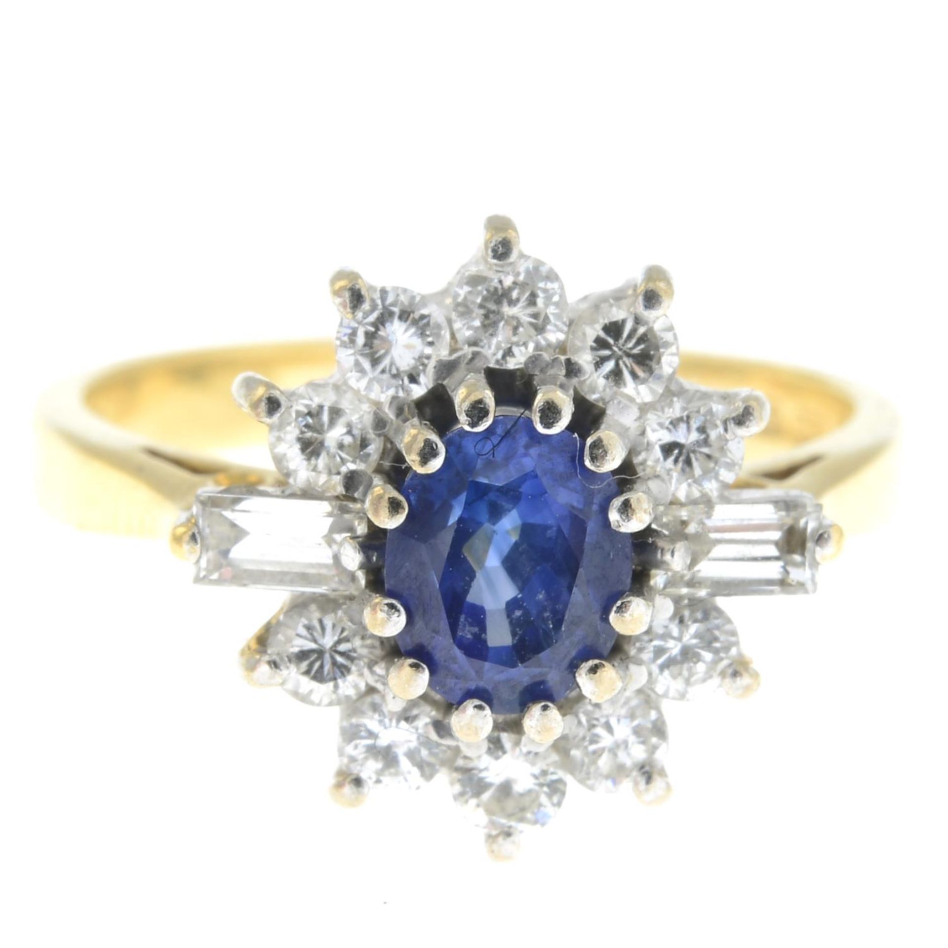 An 18ct gold sapphire ring, with baguette-cut diamond sides and brilliant-cut diamond surround.