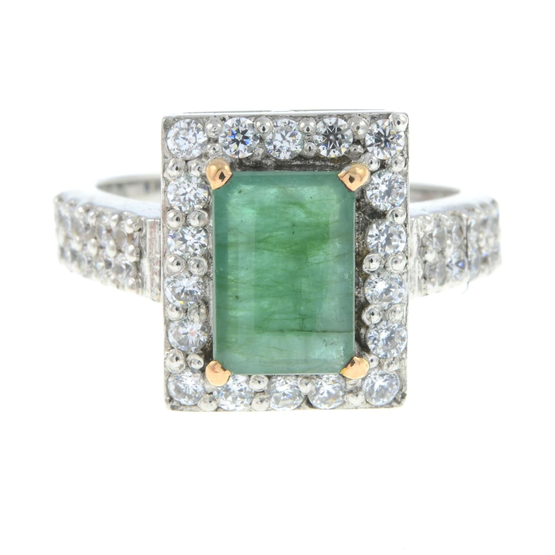 An emerald and colourless gem dress ring.Emerald calculated weight 1.11cts,