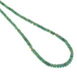 A graduated emerald faceted bead necklace.Clasp stamped 18ct.Length 45cms.