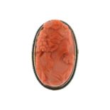 A coral cameo brooch.Coral is untested.Stamped silver.Length 3cms.