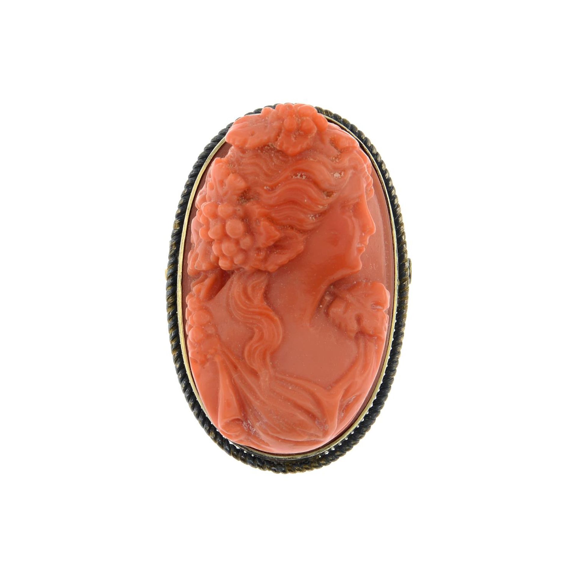 A coral cameo brooch.Coral is untested.Stamped silver.Length 3cms.