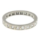 A diamond and colourless gem full eternity ring.Ring size M.