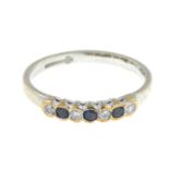 A 9ct gold diamond and sapphire half eternity ring.Estimated total diamond weight 0.15ct.