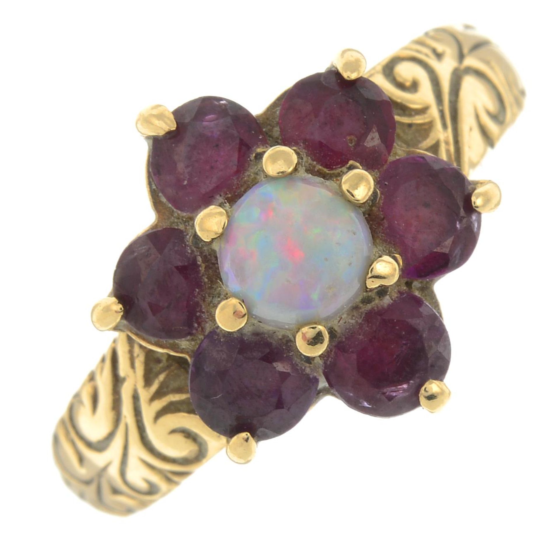 A 9ct gold ruby and opal cluster ring.Hallmarks for London.Ring size M.