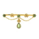 An Edwardian peridot and split pearl brooch.