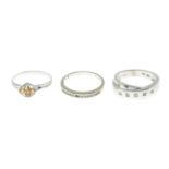 Three 9ct gold gem-set rings.9ct gold diamond half eternity ring,