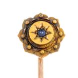 A late 19th century 15ct gold sapphire stickpin.Stamped 15ct.Length of stickpin head 1.1cms.