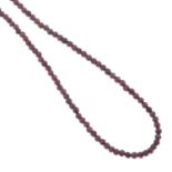 A garnet faceted bead necklace.Clasp stamped 375.Length 45cms.