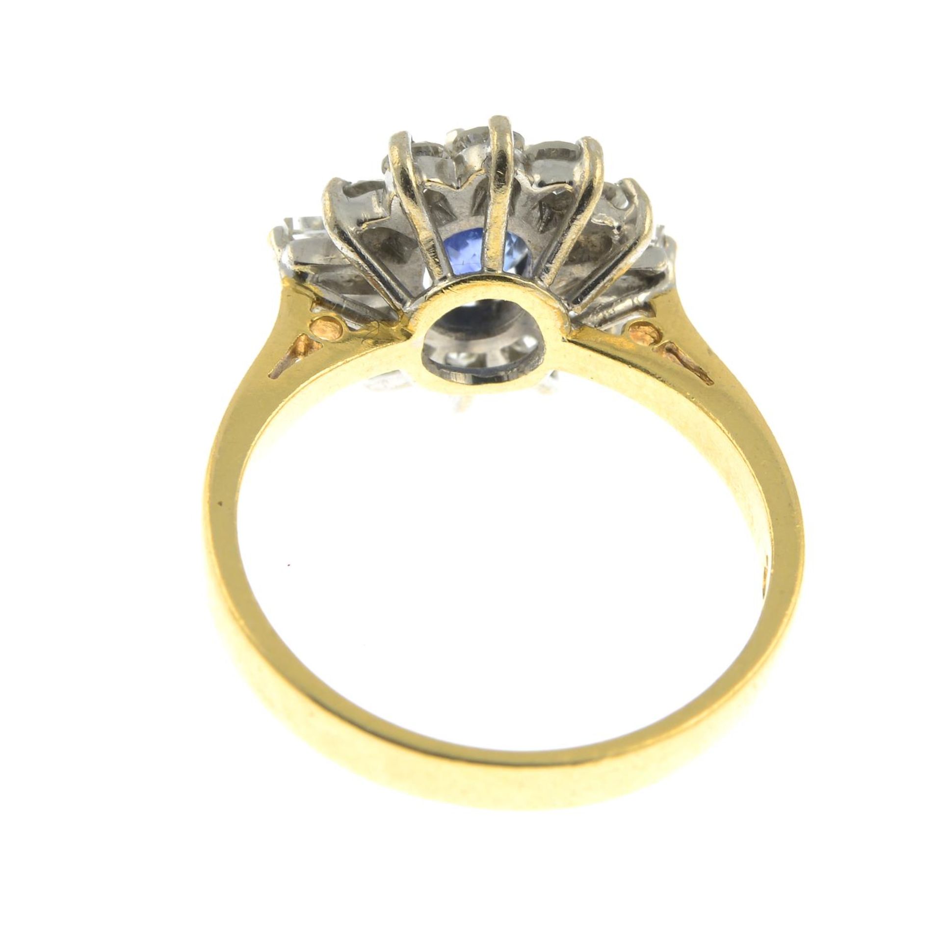 An 18ct gold sapphire ring, with baguette-cut diamond sides and brilliant-cut diamond surround. - Image 2 of 2