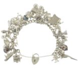 A charm bracelet, together with assorted charms.