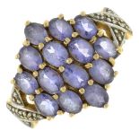 A tanzanite and diamond dress ring.Stamped 9k.Ring size N.