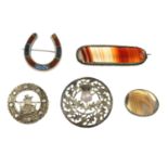 A selection of mainly Scottish agate brooches, to include an agate panel horseshoe brooch.