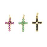 Three 9ct gold gem set cross pendants.