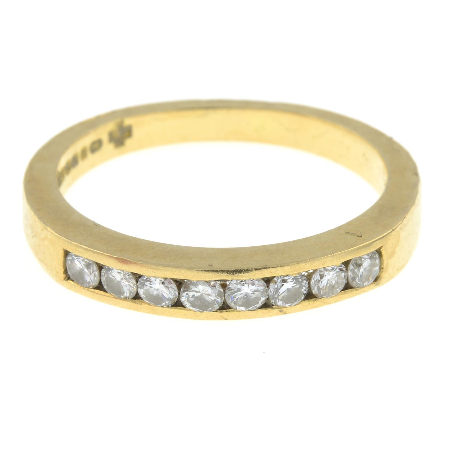 An 18ct gold brilliant-cut diamond half eternity ring.Estimated total diamond weight