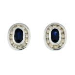 A pair of 9ct gold sapphire and diamond earrings.Estimated diamond weight 0.16ct.Hallmarks for