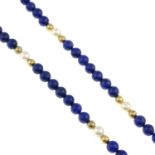 A lapis lazuli and cultured pearl necklace.Length 66cms.