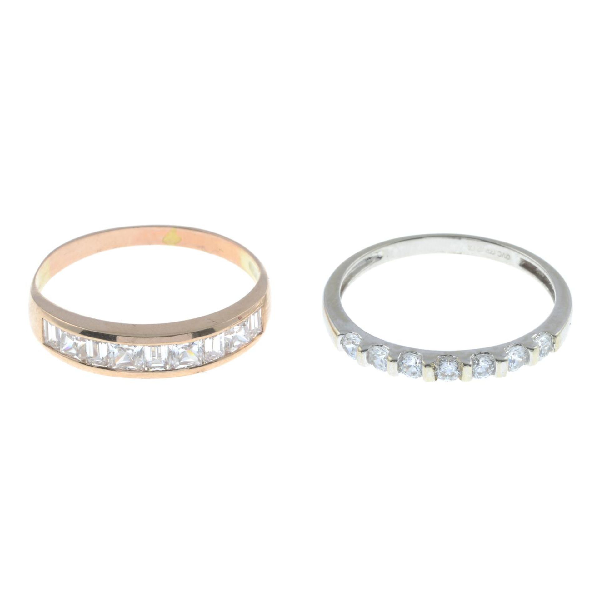 Two cubic zirconia half eternity rings.14ct gold cubic zirconia seven-stone ring,