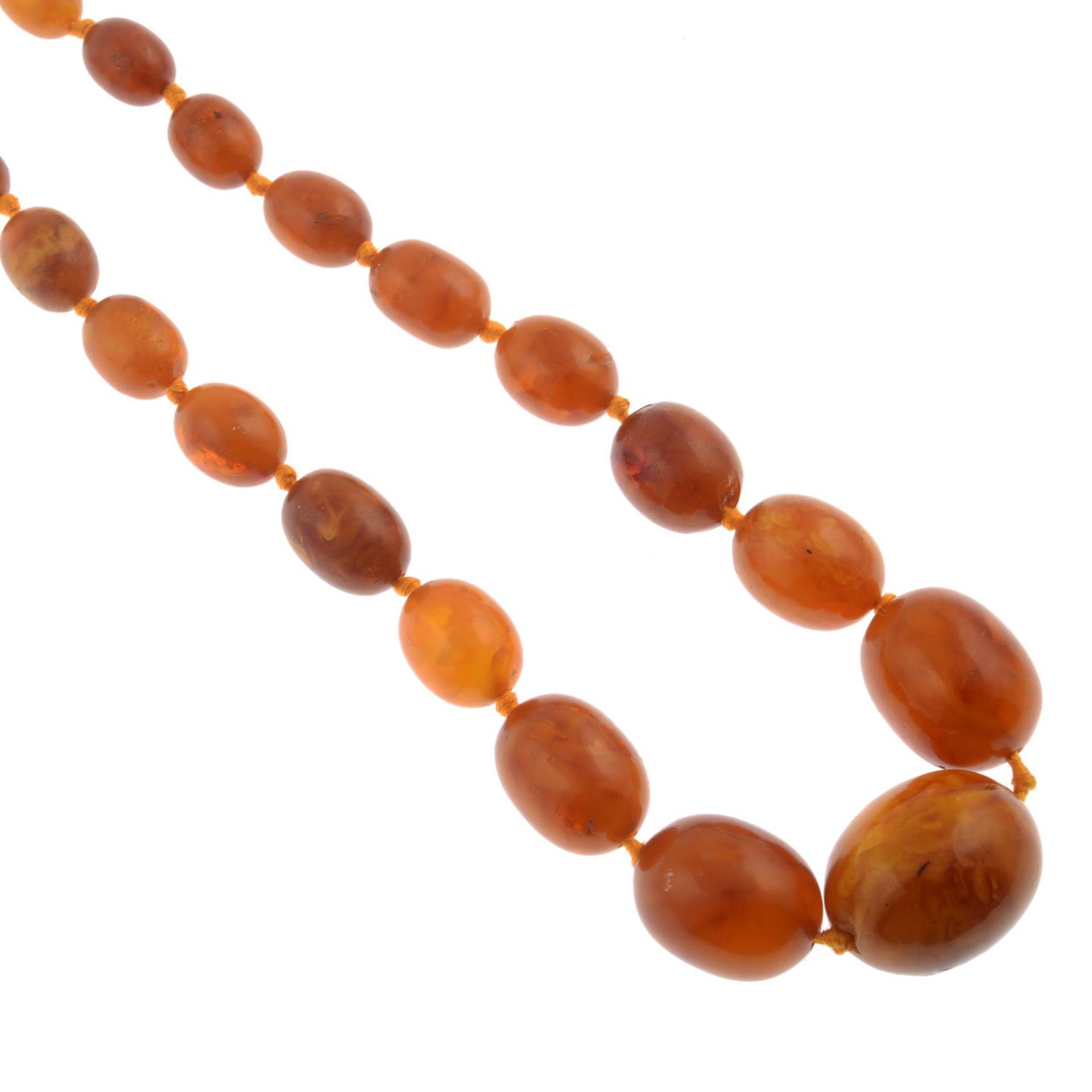 A graduated amber bead necklace.Amber is untested.Diameter of beads 0.9 to 2.6cms.