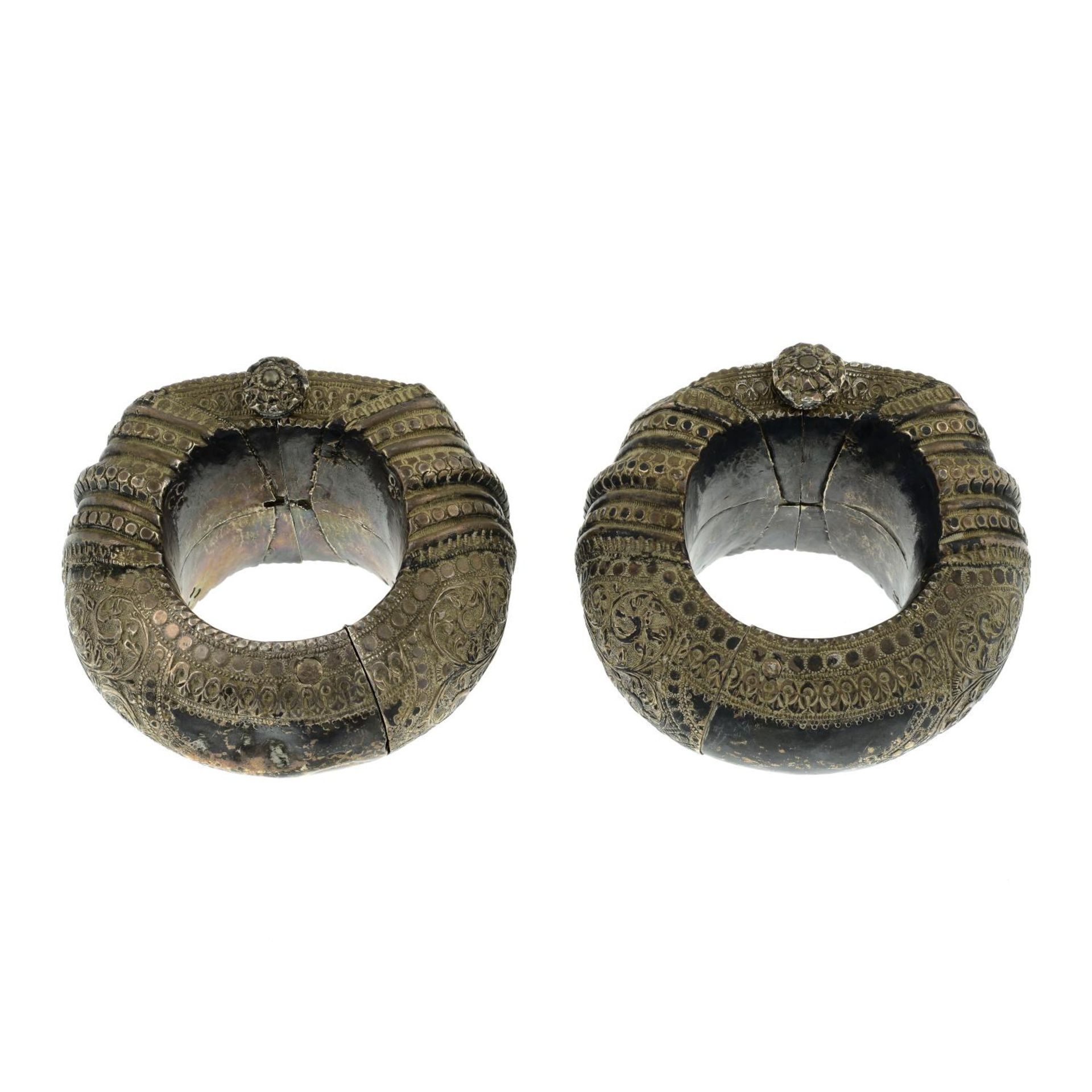 A pair of hammer textured, hinge tribal bangles featuring a foliate design.Inner diameter 7cms. - Image 3 of 4