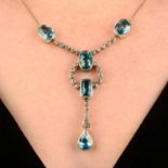 A blue zircon and old-cut diamond necklace.Estimated total diamond weight 0.60ct.Length of pendant