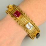 A mid 20th century 18ct gold multi-gem woven-link bracelet.Pink tourmaline calculated weight