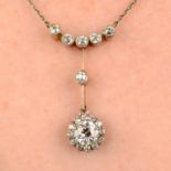 An early 20th century silver and gold, old-cut diamond cluster necklace.