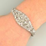 An Art Deco platinum vari-cut diamond bracelet.Two principal diamonds estimated total weight