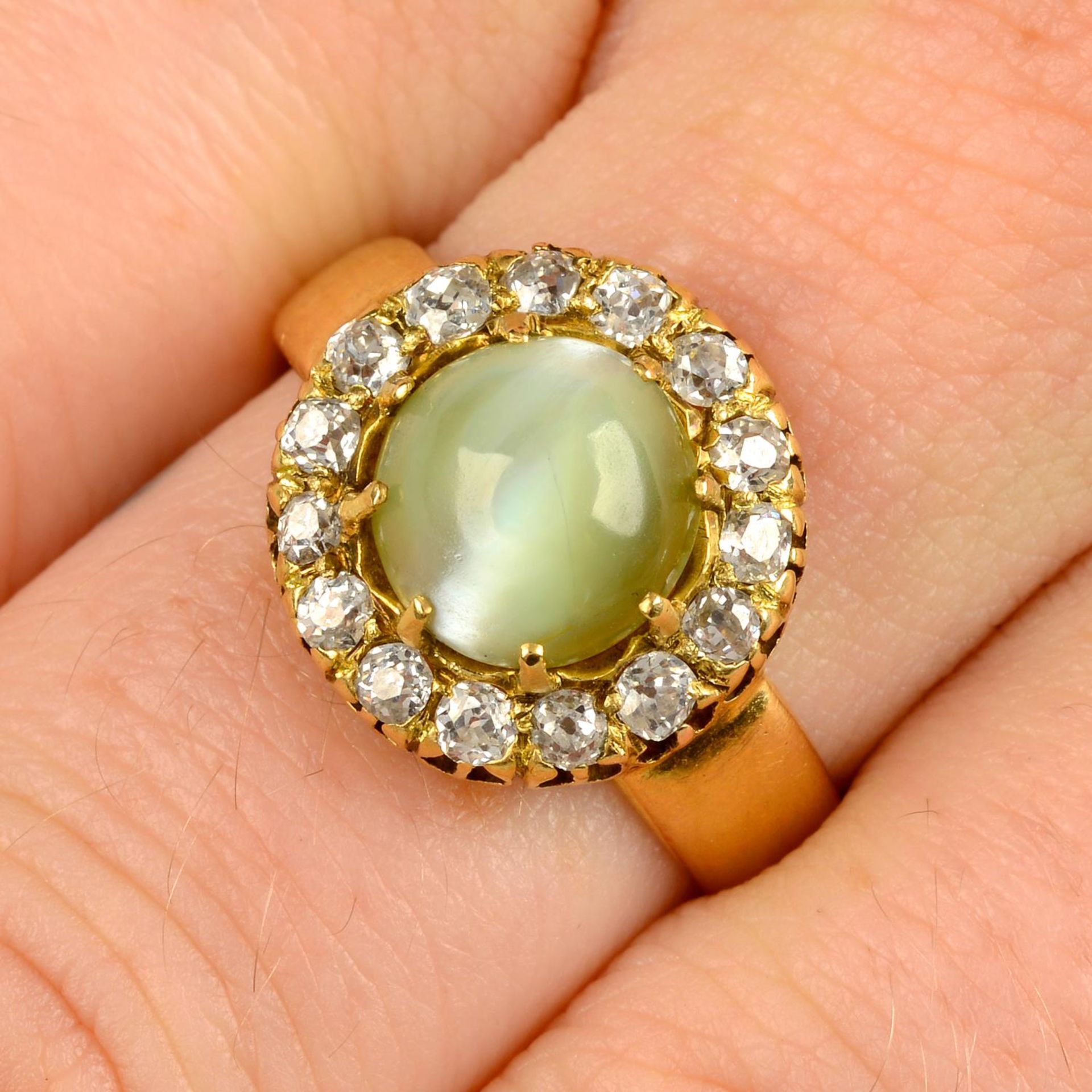A late Victorian gold cat's-eye chrysoberyl and old-cut diamond cluster ring.