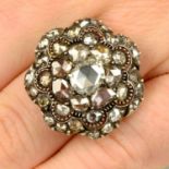 A rose-cut diamond floral cluster dress ring.Estimated dimensions of principal diamond 6.8 by