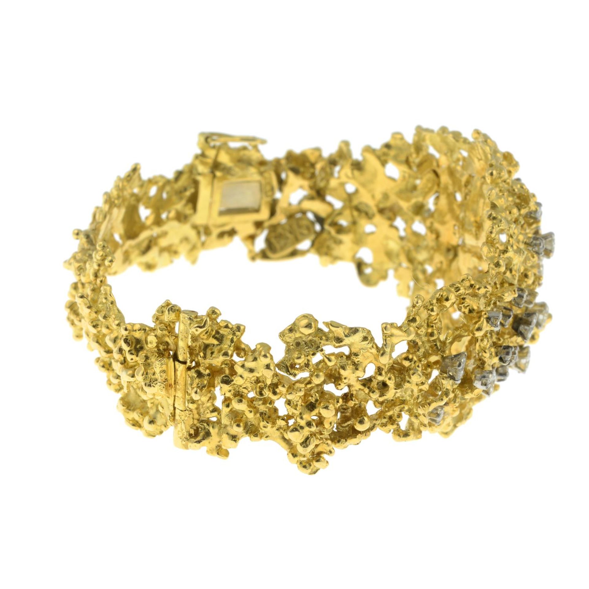 A 1970's textured openwork 18ct gold and scattered brilliant-cut diamond hinged bangle, - Image 7 of 7