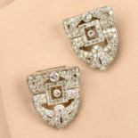 A pair of Art Deco platinum diamond clip brooches.Estimated total diamond weight 5cts,