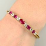 A late Victorian 18ct gold Burmese ruby and diamond hinged bangle.With report 78165-89,